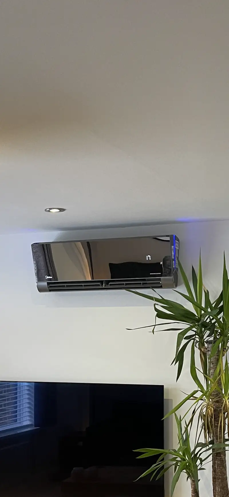 Air conditioning installation in York Newly installed mirror-finish wall-mounted air conditioning unit in a York living room