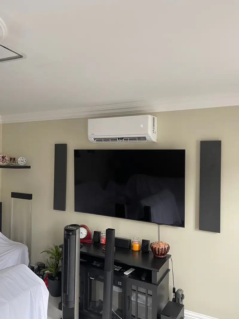 Air conditioning in Selby Air conditioning unit installed above a wall-mounted television in a Selby living room