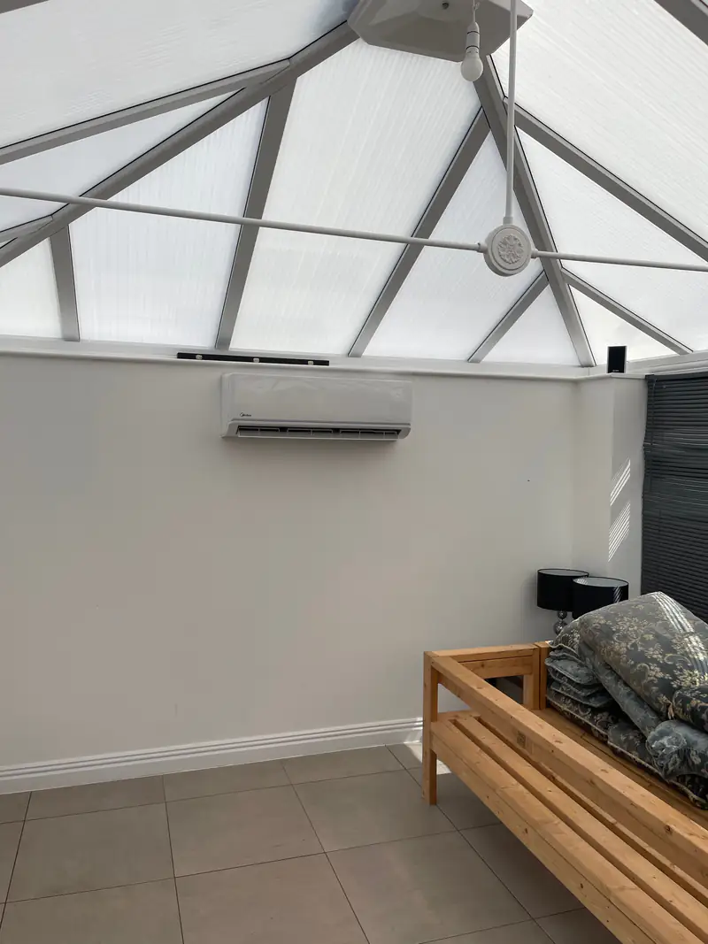 Conservatory air conditioning in Haxby Air conditioning unit mounted on the wall of a conservatory, a common request from homes in Haxby