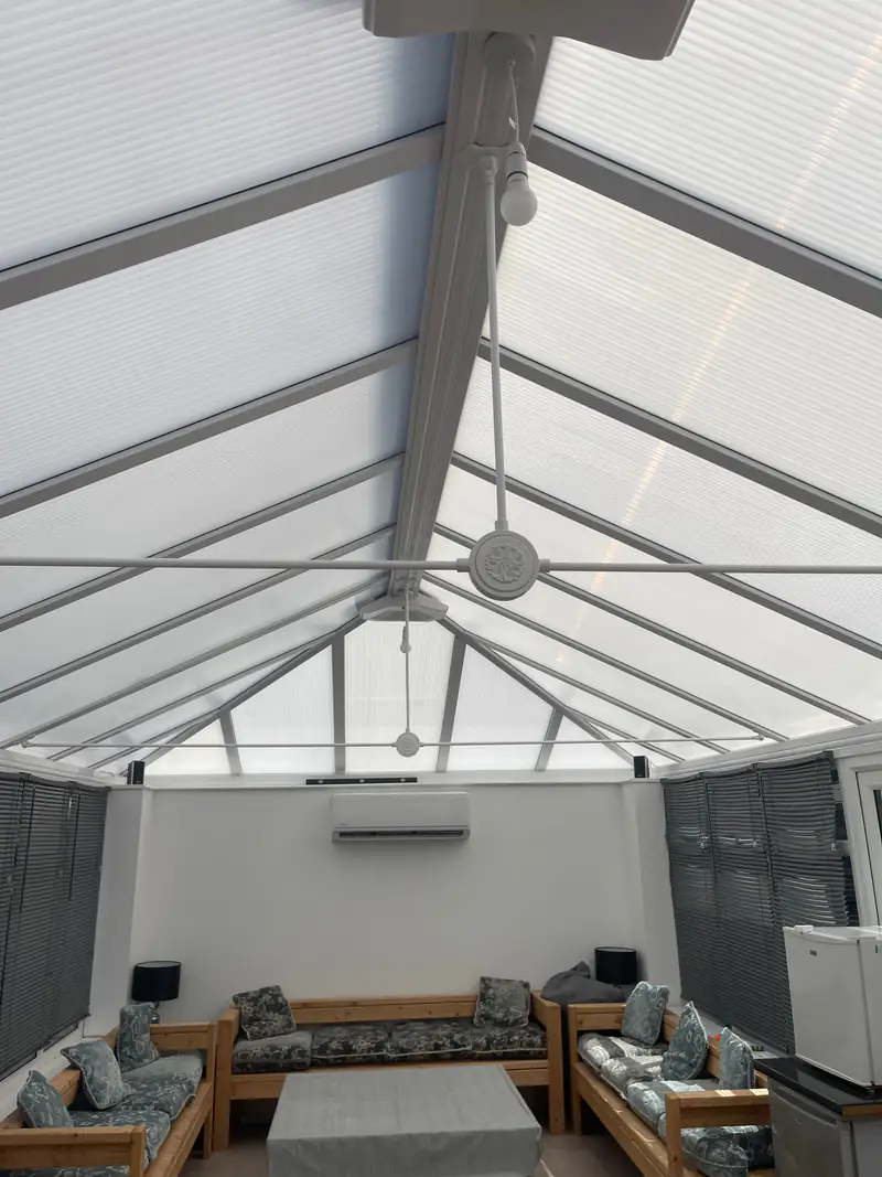 Conservatory air conditioning in York Air conditioning unit on the solid end wall of a glazed York conservatory with seating