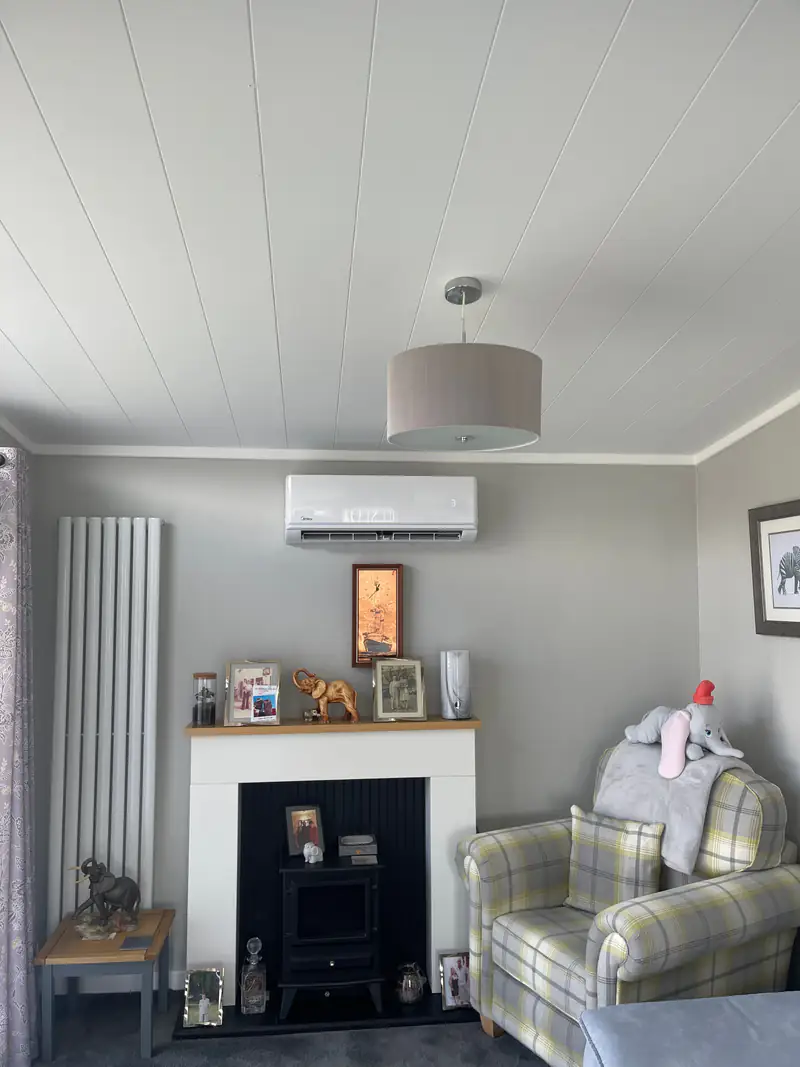 Domestic air conditioning in York Wall-mounted air conditioning unit above the fireplace in a York family living room
