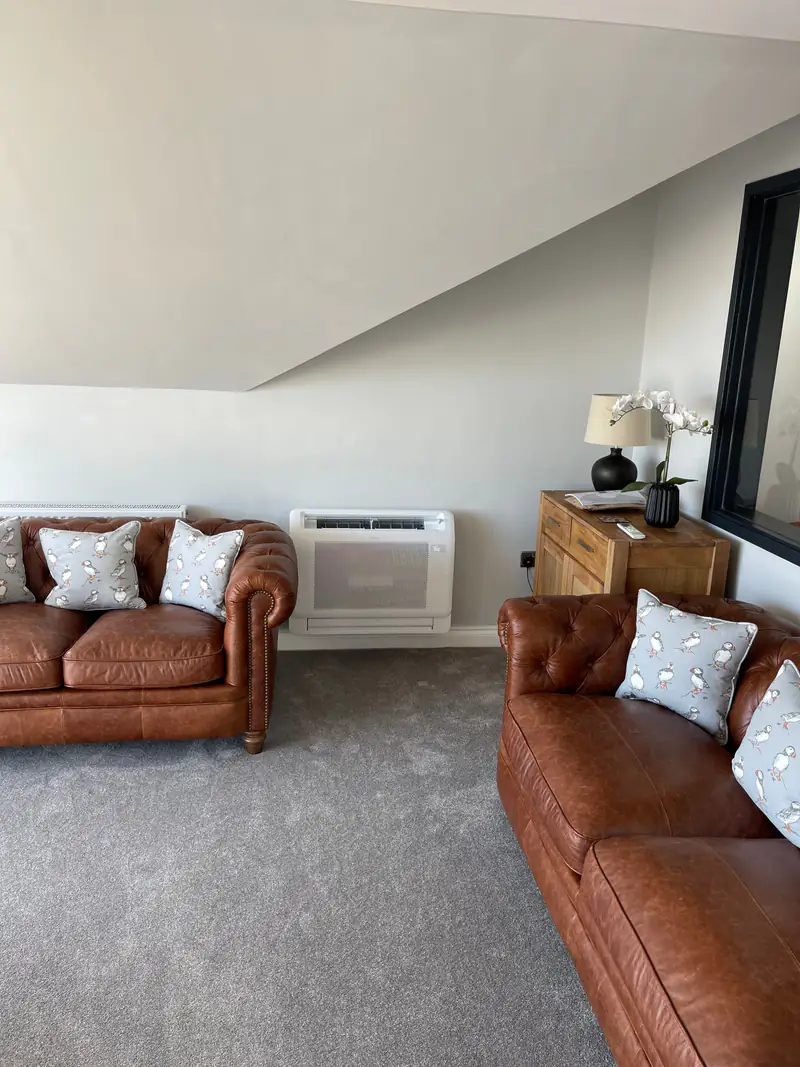 Floor-standing air conditioning in Bishopthorpe Floor-standing air conditioning console in a lounge with leather sofas, an option for period rooms in Bishopthorpe