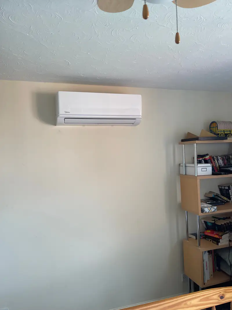 Office air conditioning in York Wall-mounted air conditioning unit in a York home office with shelving
